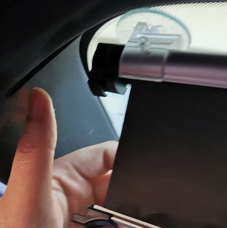 Close-up of the ABS pull handle on the windshield shade