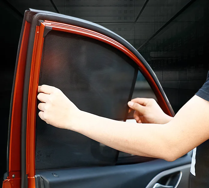 Mesh side-window shade fitted to an open door