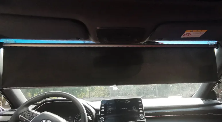 Windshield shade stowed in its cassette